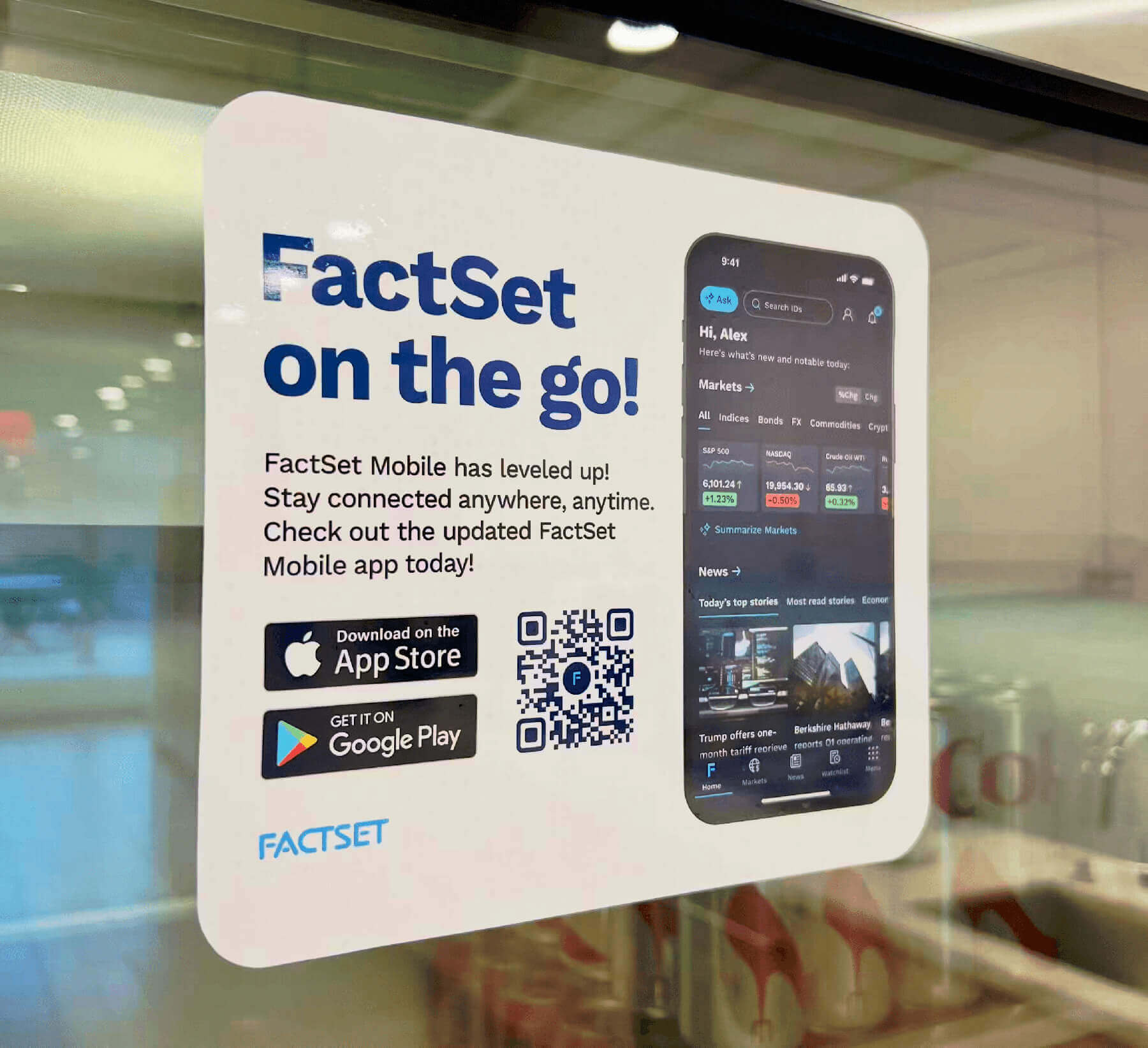 FactSet mobile app promotional window cling with a pic of the mobile app and text that says